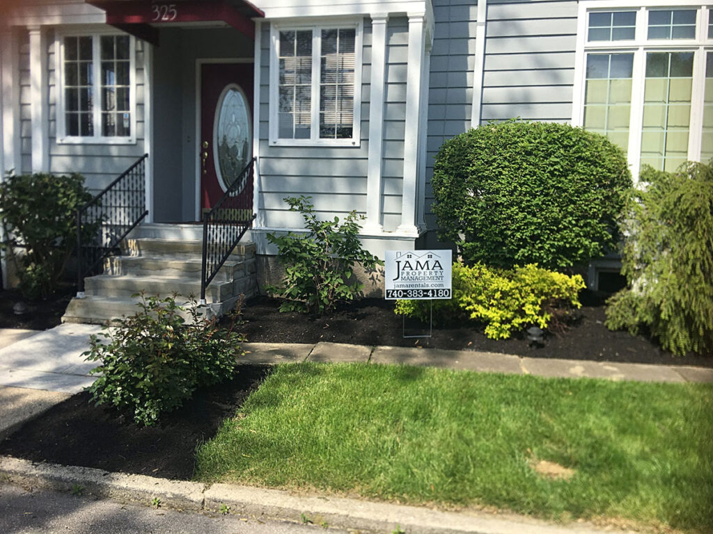 Front view of a JAMA residential property, neatly landscaped.