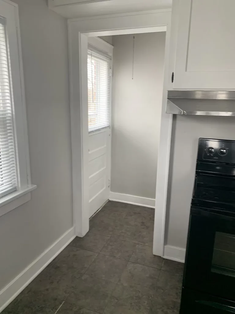 Turoff house, kitchen area with fresh paint and flooring.